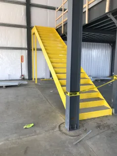 Speed Cost Simplicity Express Mezz System Checks All Boxes_Express_Mezz_Yellow_Stairs-scaled-1-1536x2048.jpg